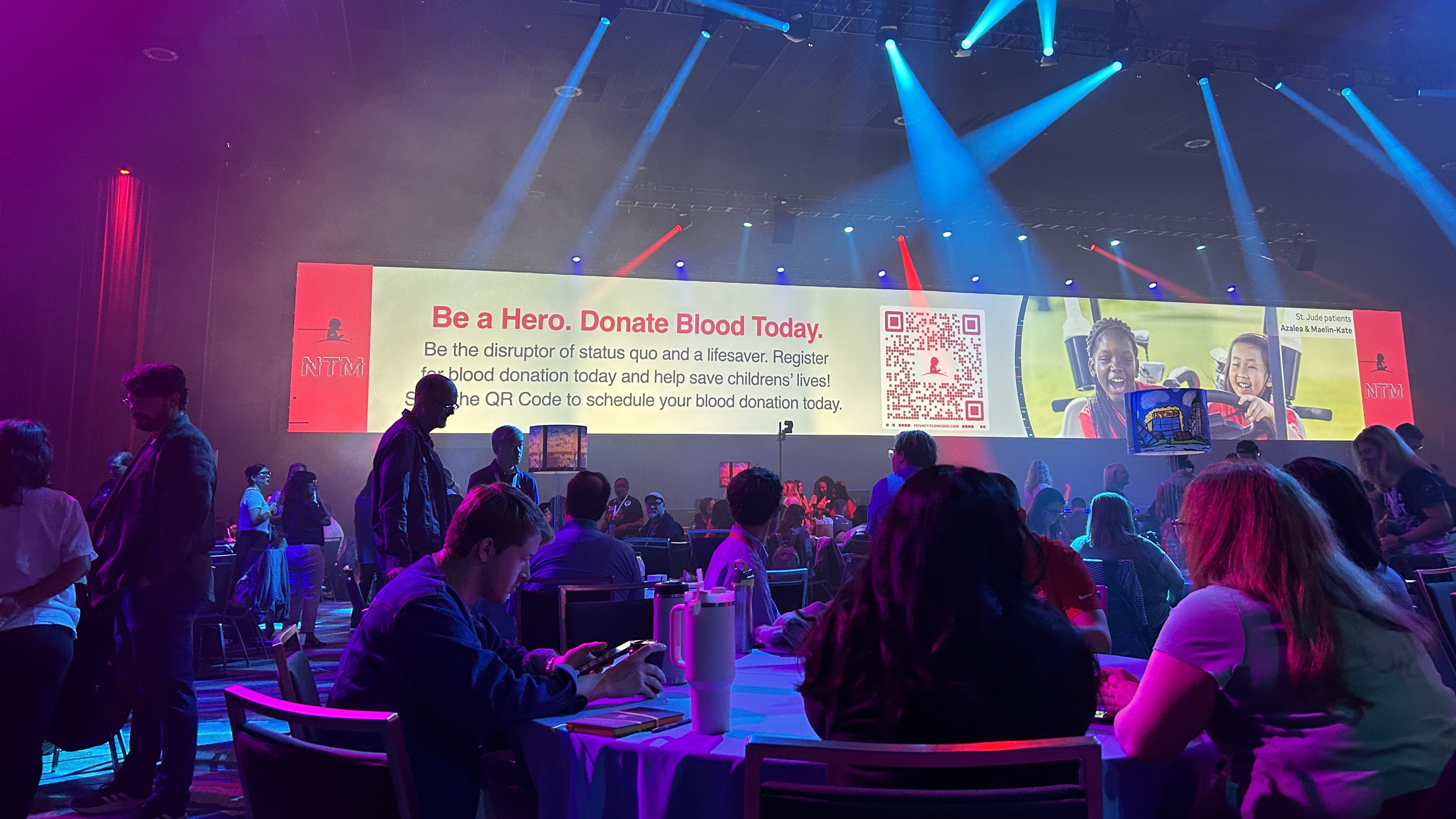 Image showing the call to donate blood banner in a conference room.
