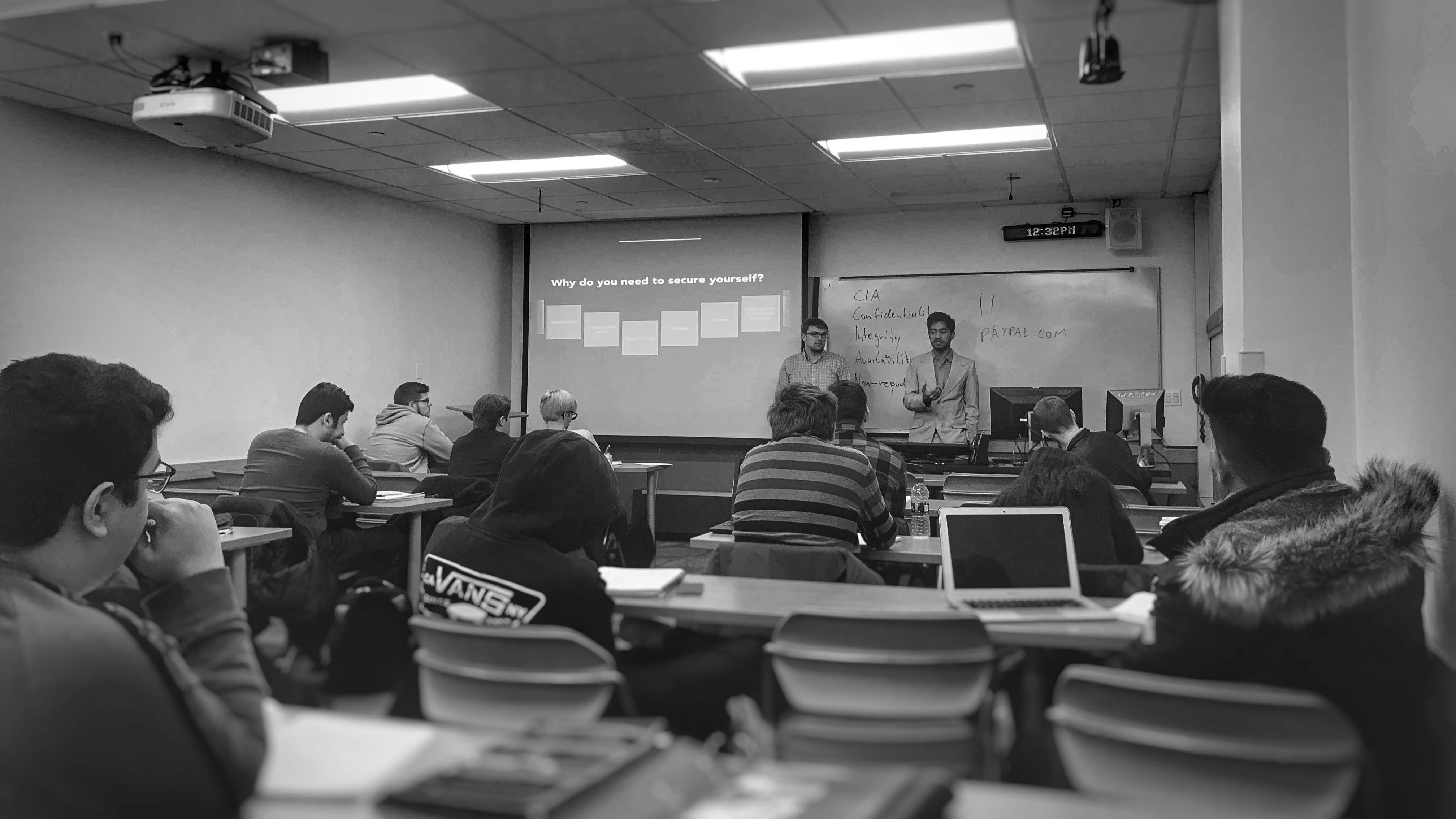 Image showing a classroom with a lecture given by two people.